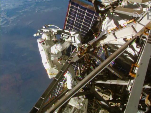 US astronauts speed through ISS spacewalk