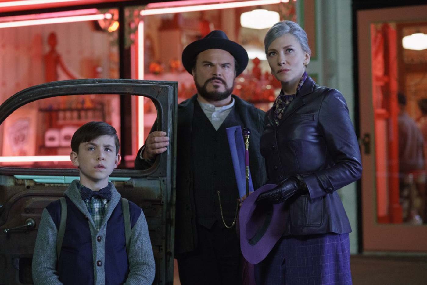 DIFFERENT. Owen Vaccaro (Lewis Barnavelt), Jack Black (Uncle Jonathan) and Cate Blanchett (Mrs. Zimmerman) in 'The House With A Clock in Its Walls.' 