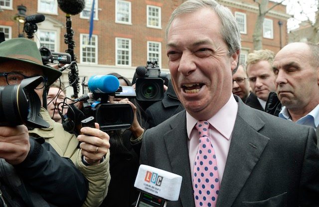LONG SHOT. The leader of Britain's United Kingdom Independence Party (UKIP) Nigel Farage (C)is surrounded by journalists during an event to announce his party's key election pledges in London, Britain 30 March 2015. Facundo Arrizabalaga/EPA 
