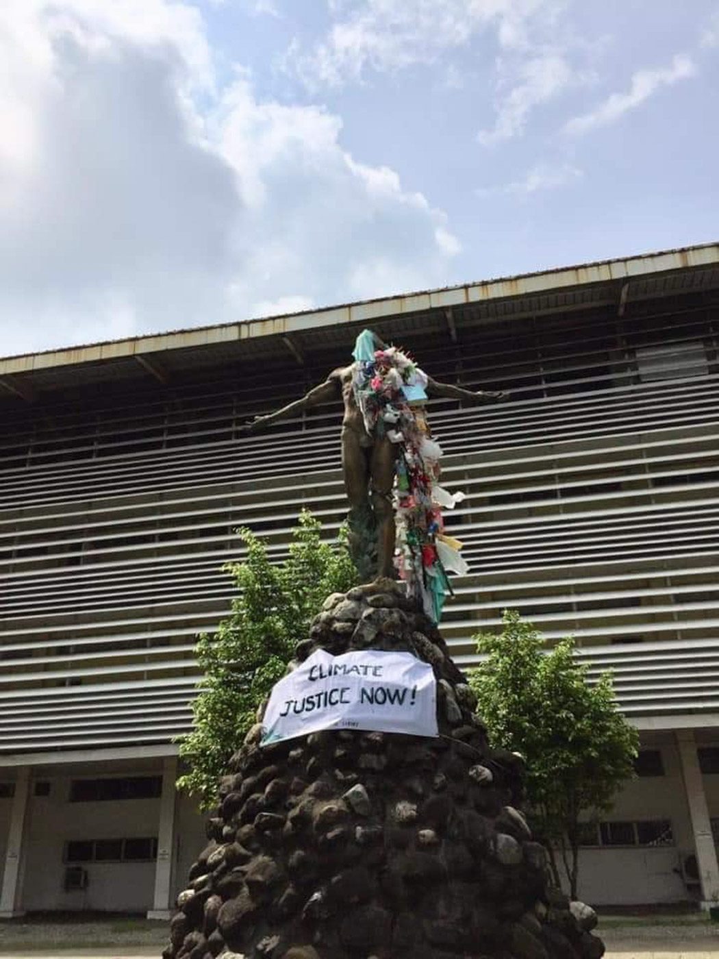 TRASHED. The Oblation at UP Visayas wears trash as a protest to highlight insufficient actions to address the climate crisis. Photo from Youth Strike for Climate Philippines. 