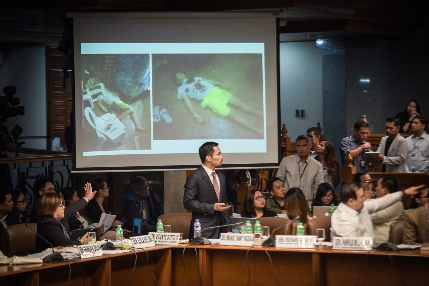 SENATE PROBE. Senator Leila de Lima shows photos of the crime scene. Photo by LeAnne Jazul/Rappler  