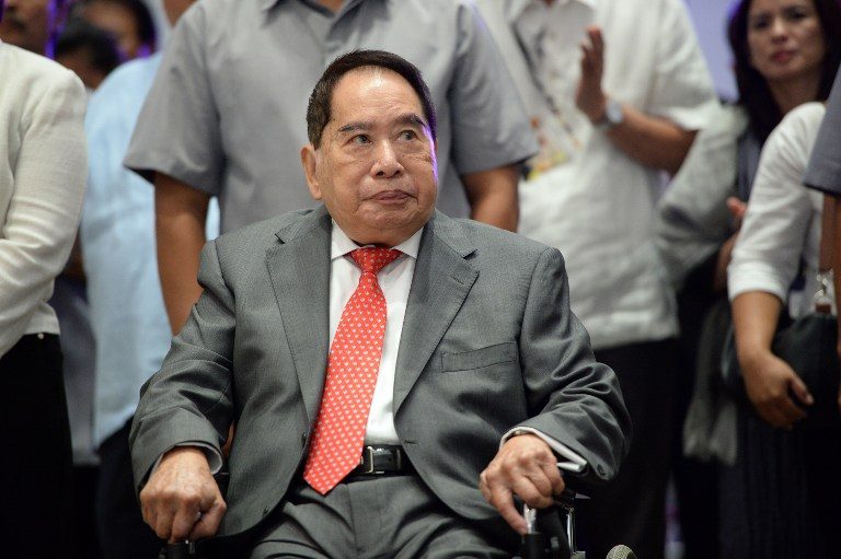 TOP OF THE LIST. In this file photo, Filipino-Chinese property tycoon Henry Sy Sr arrives for the opening of one of his shopping malls, the SM Aura, in Manila on May 16, 2013. File photo by Ted Aljibe/AFP   