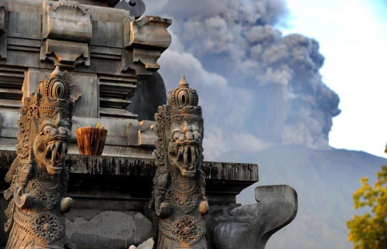 Bali volcano spews smoke and ash, disrupting flights