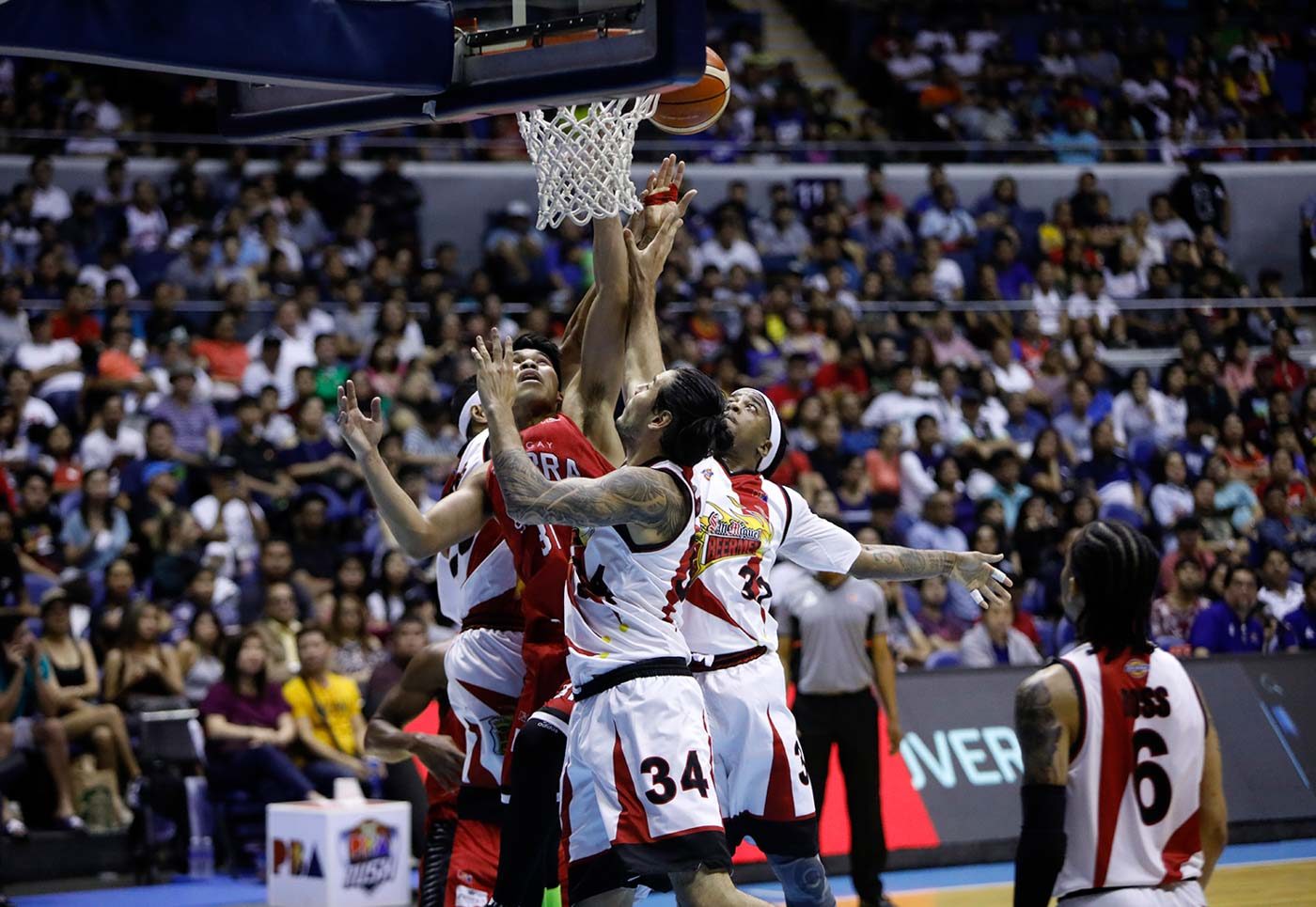 Ginebra trips San Miguel in heated rematch