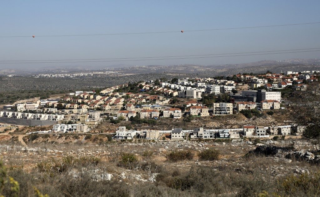 Israelis celebrate, Palestinians rail against U.S. settlement move
