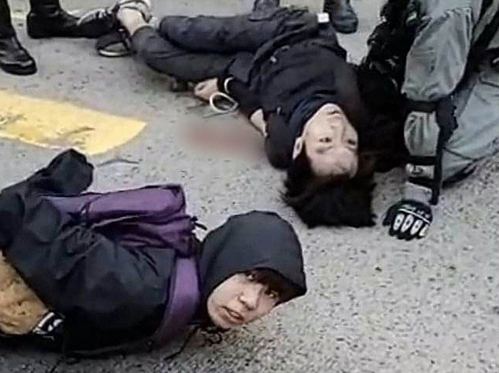Hong Kong police shoot protester as protests start working week