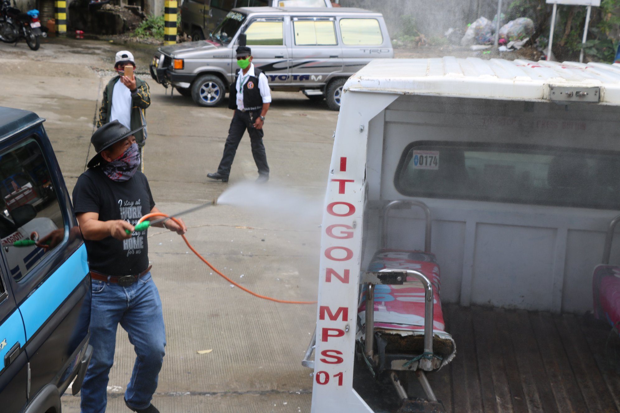GIN WASH. Public vehicles are disinfected with gin. Photo from the Facebook page of Itogon Mayor Victorio Palangdan 