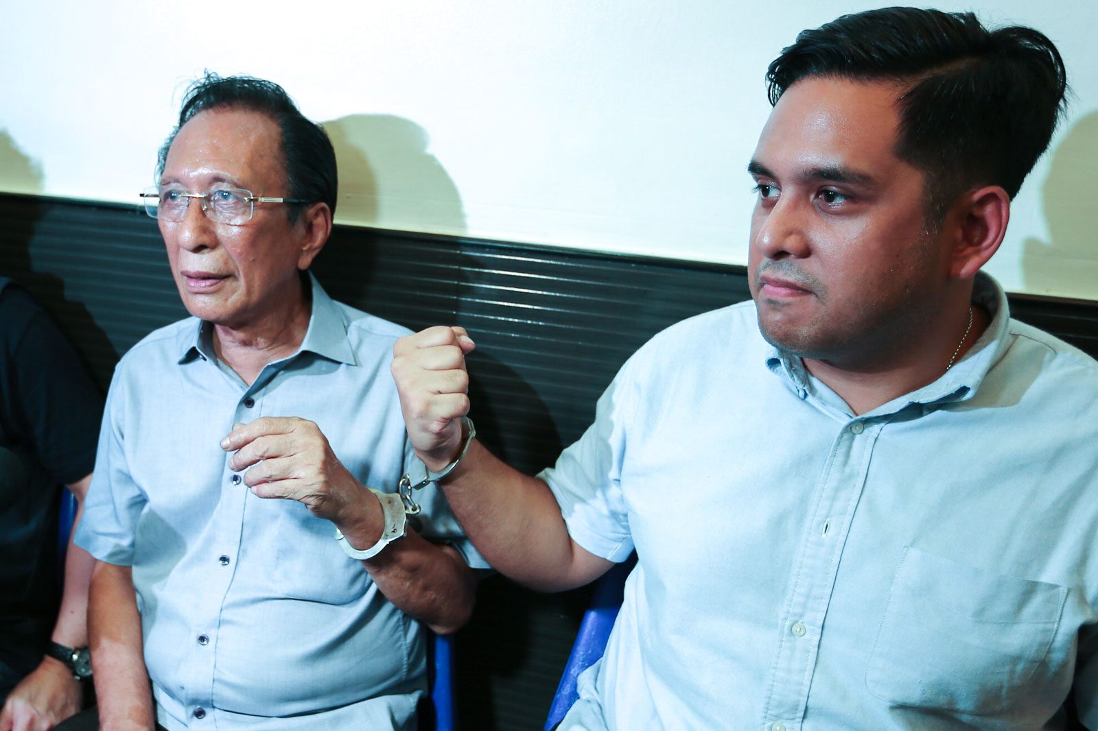 VOTE BUYING? Quezon City mayoral candidate Bingbong Crisologo (left) is arrested for alleged obstruction of justice in relation to alleged vote buying on May 12, 2019. Photo by Jire Carreon/Rappler.  