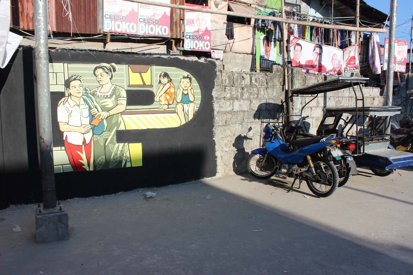 LEFT. This mural showing Lourdes and her grandchildren was painted near a basketball court by street artists and residents of an urban poor community in Muntinlupa. Street art by Gerilya 