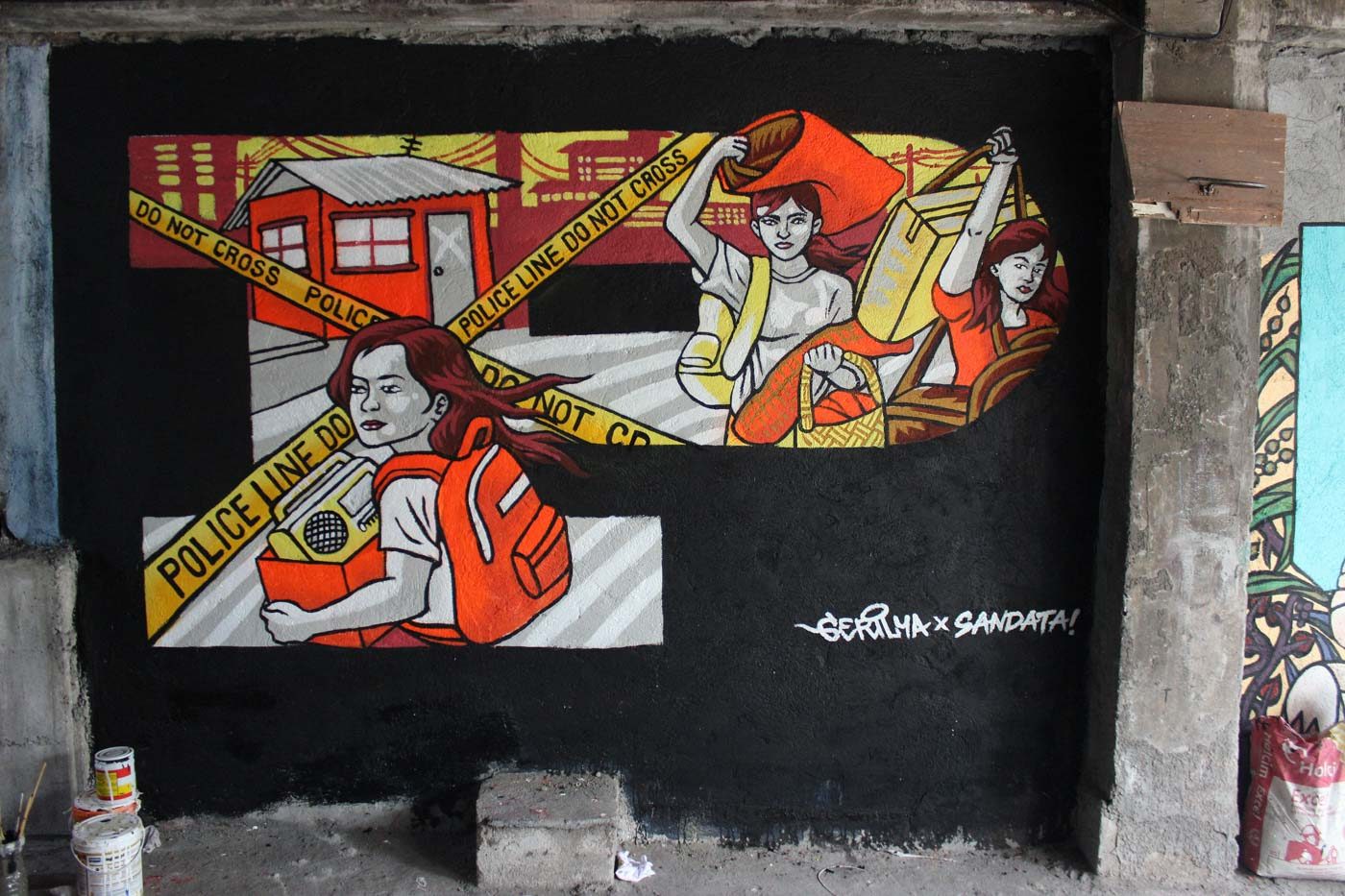 AWAY. A mural showing Irene abandoning her home after Gerry’s killing is by street artist collective Gerilya, together with local residents, in a wall in an alley in Quezon City. 