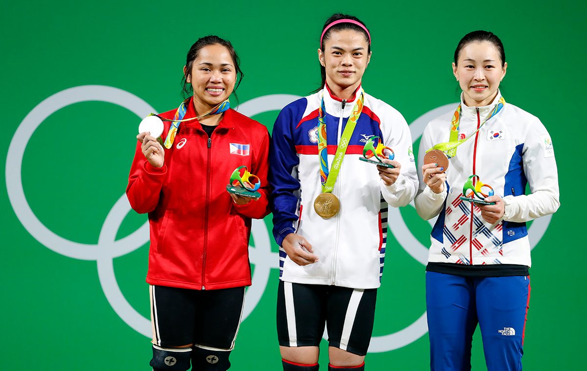 HISTORY. Hidilyn Diaz (L) stands with fellow medalists Hsu Shu-ching (C) of Taiwan, with her gold medal, and Yoon Jin-hee (R) of South Korea, with the bronze. EPA/NIC BOTHMA 