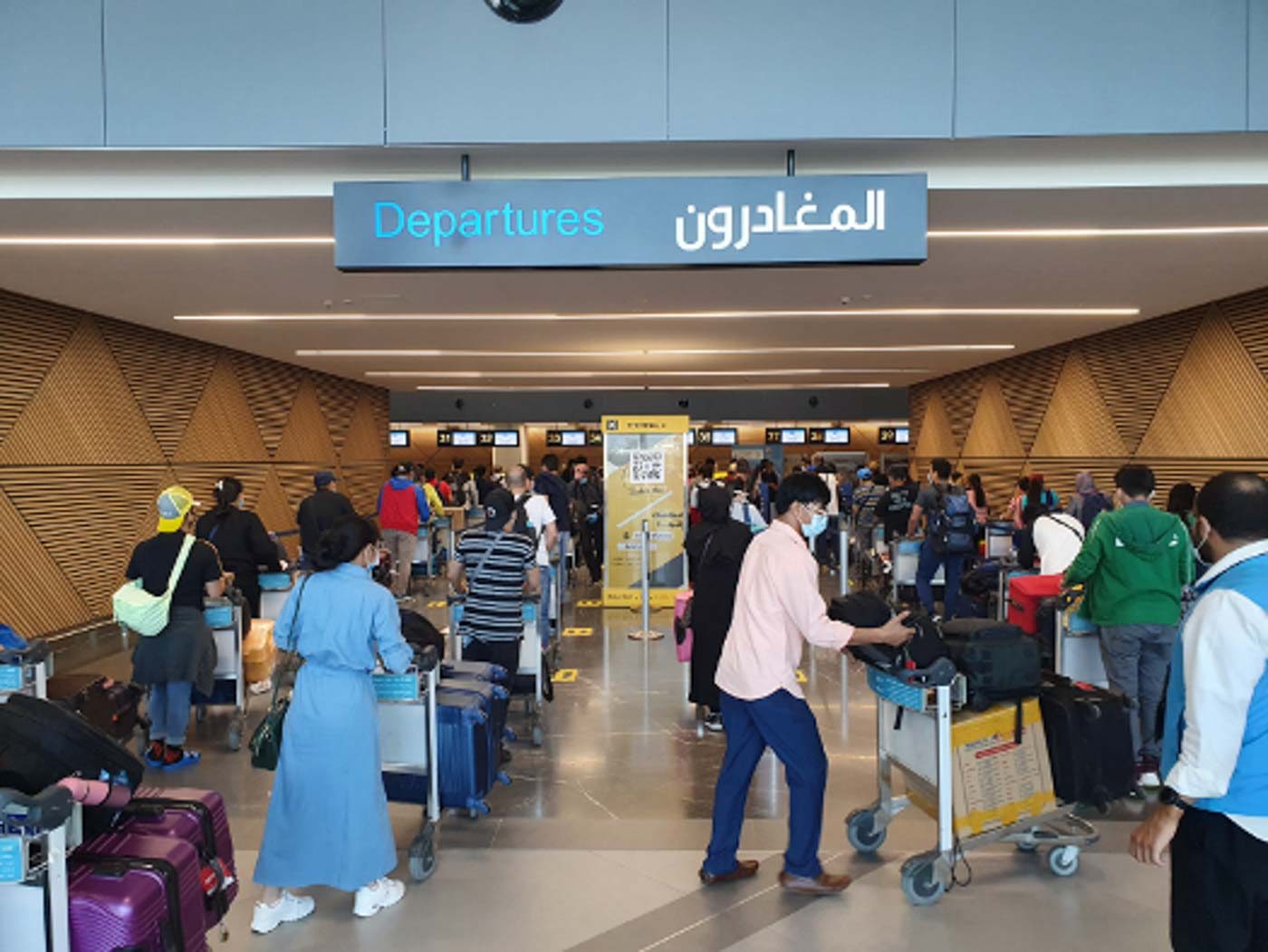 HOMEBOUND. Some 300 overseas Filipinos prepare to check in at Kuwait International Airport, before taking their chartered Kuwait Airways flight to Manila on July 1, 2020. Photo from Philippine embassy in Kuwait 