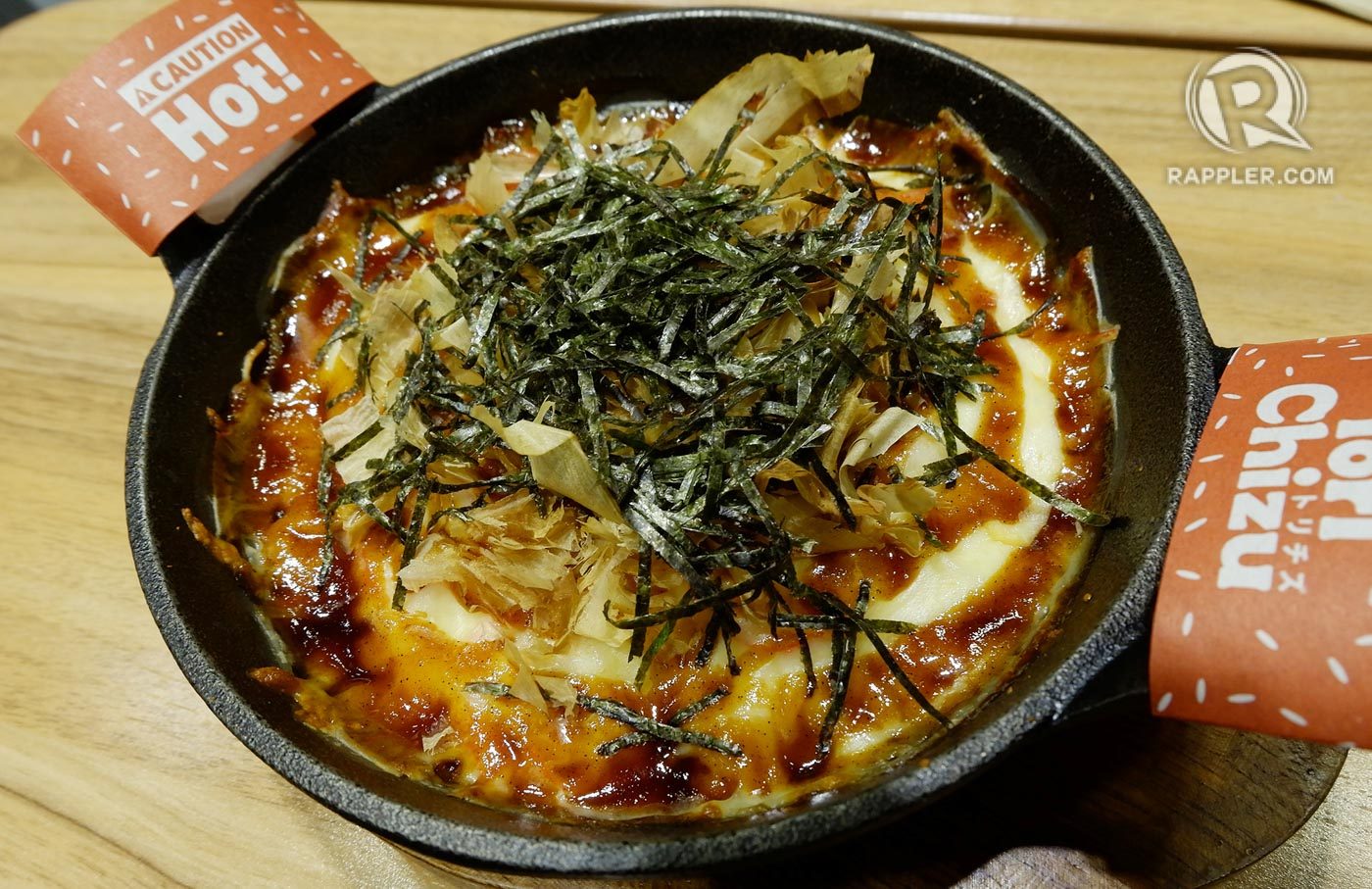 TASTY TAKOYAKI. Takoyaki with a twist, served with kani and topped with strips of nori. 