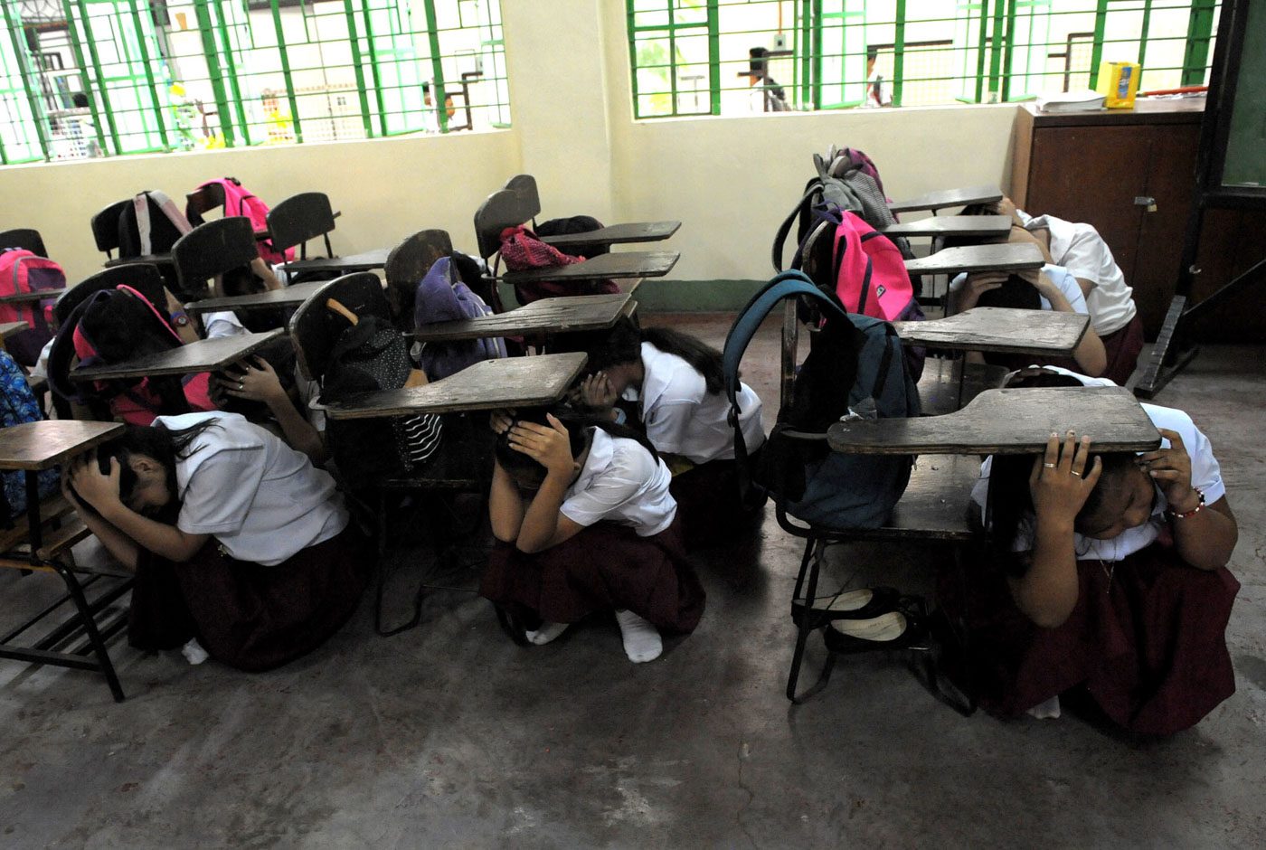 Students participate on the 4th Metro Manila simultaneous Earthquake drill in Artaullo High School , Manila.
Photo by Inoue Jaena/Rappler 