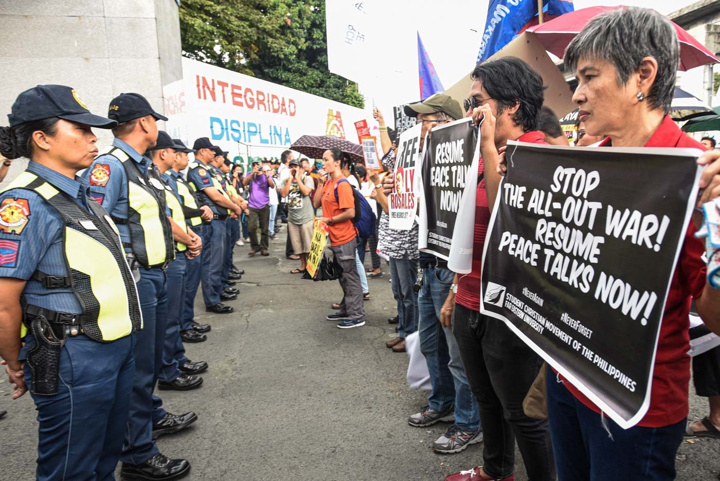 'STOP THE ALL-OUT WAR.' Various activists protest in front of the national headquarters of the Philippine National Police in Camp Crame on November 4, 2019. Photo by Maria Tan/Rappler 