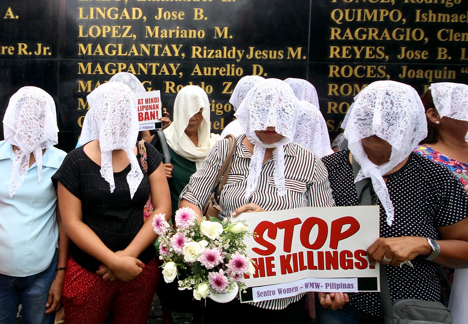 WIDOWS. Relatives of victims of extrajudicial killings wear white veils as they call for justice and reparation during the International Day for the Elimination of Violence Against Women at the Bantayog ng mga Bayani in Quezon City on November 24, 2017. Photo by Darren Langit/Rappler   