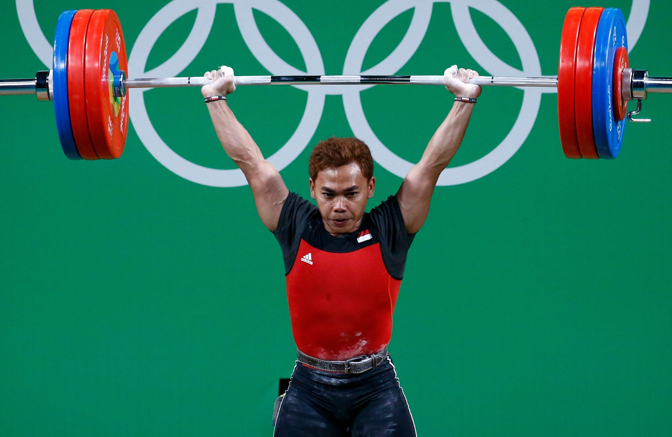 Eko Yuli Irawan berhasil meraih medali perak untuk nomor 62kg pria cabang olahraga angkat besi. Foto oleh Larry W. Smith/AFP 