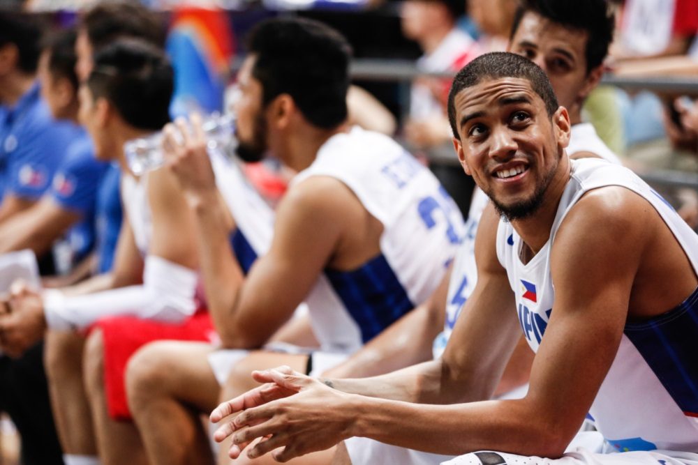 Gabe Norwood smiling on the bench. Photo from FIBA 