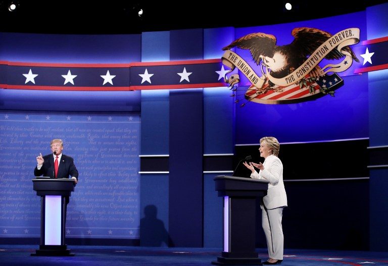 Democratic presidential nominee former Secretary of State Hillary Clinton (R) debates with Republican presidential nominee Donald Trump during the third U.S. presidential debate at the Thomas & Mack Center on October 19, 2016 in Las Vegas, Nevada. Win McNamee/Getty Images/AFP 