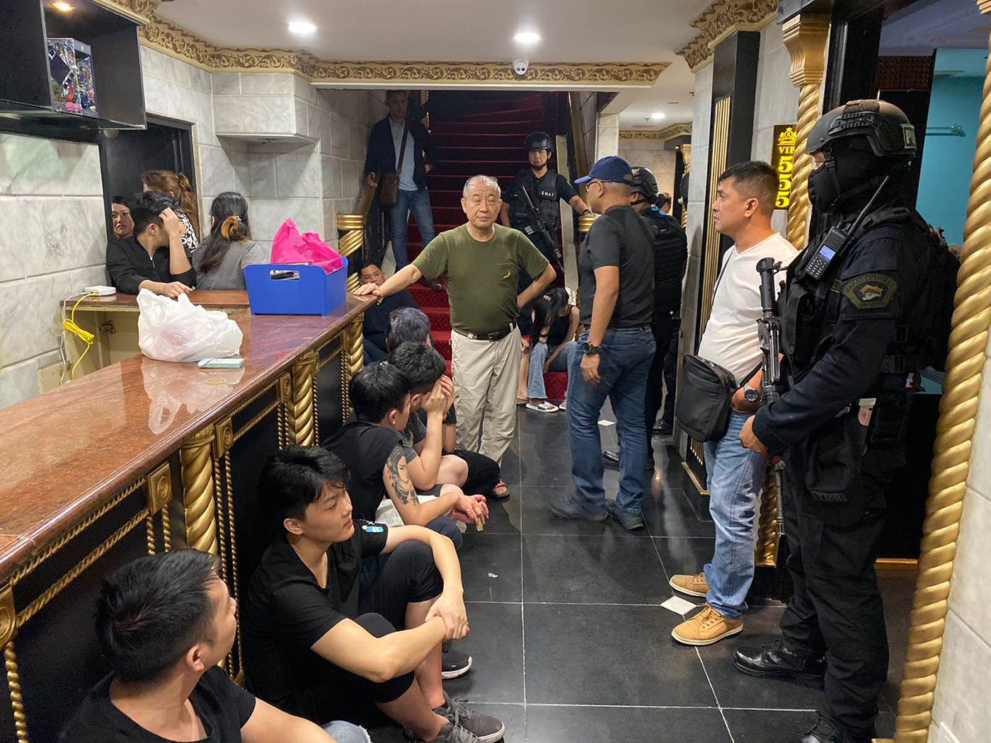RAIDED: A photo provided by Makati police shows some of the POGO workers arreste during the raid.  