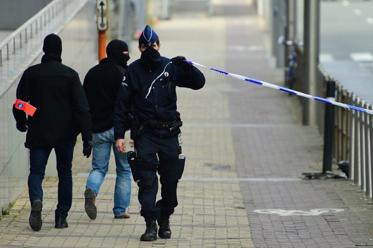 Belgian police shoot suspect in Europe-wide terror raids