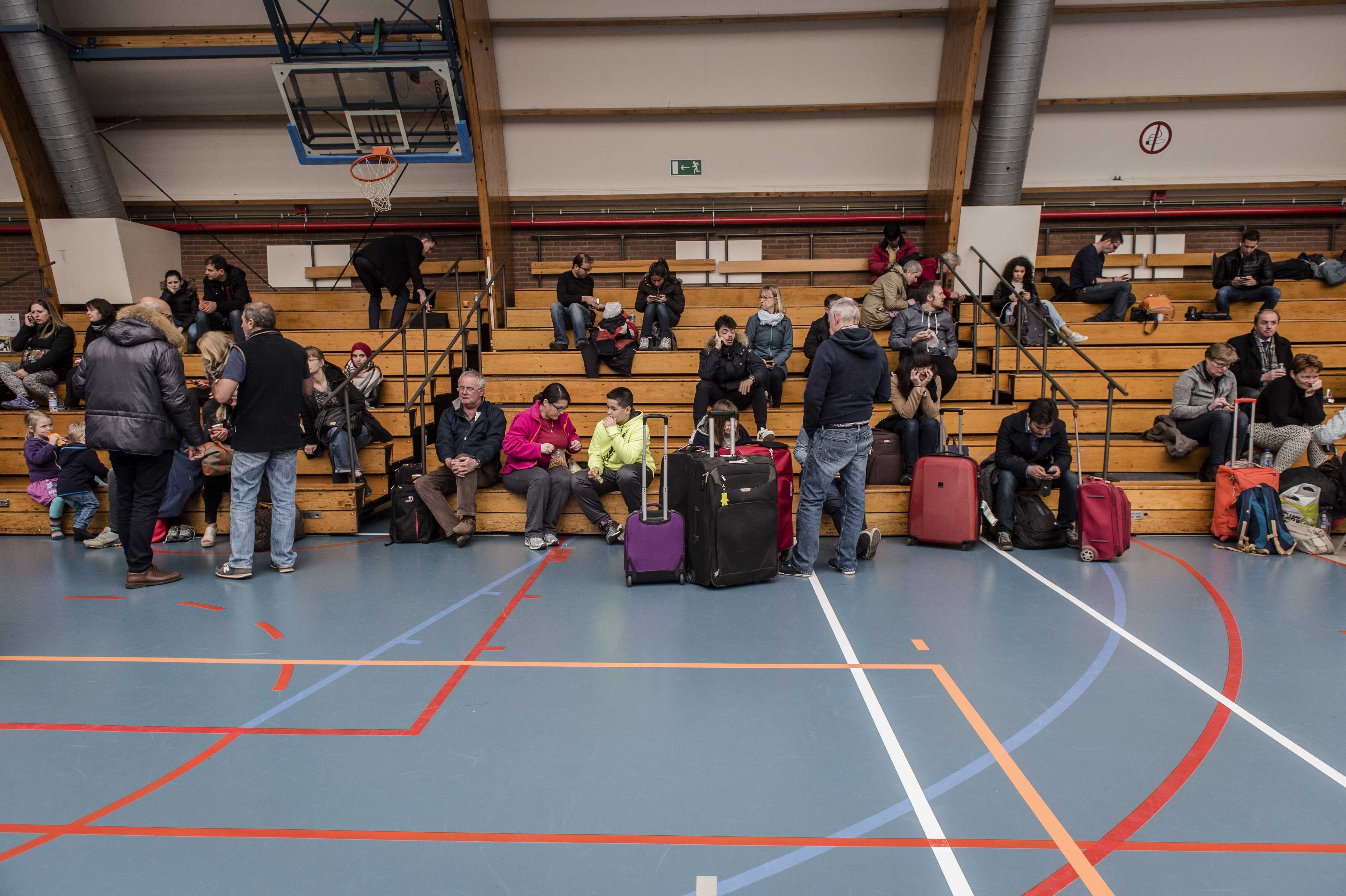 ASSEMBLED. Travellers are assembled at a sports hall in Zaventem in Brussels, Belgium, March 22, 2016. Photo by Jonas Roosens/EPA  