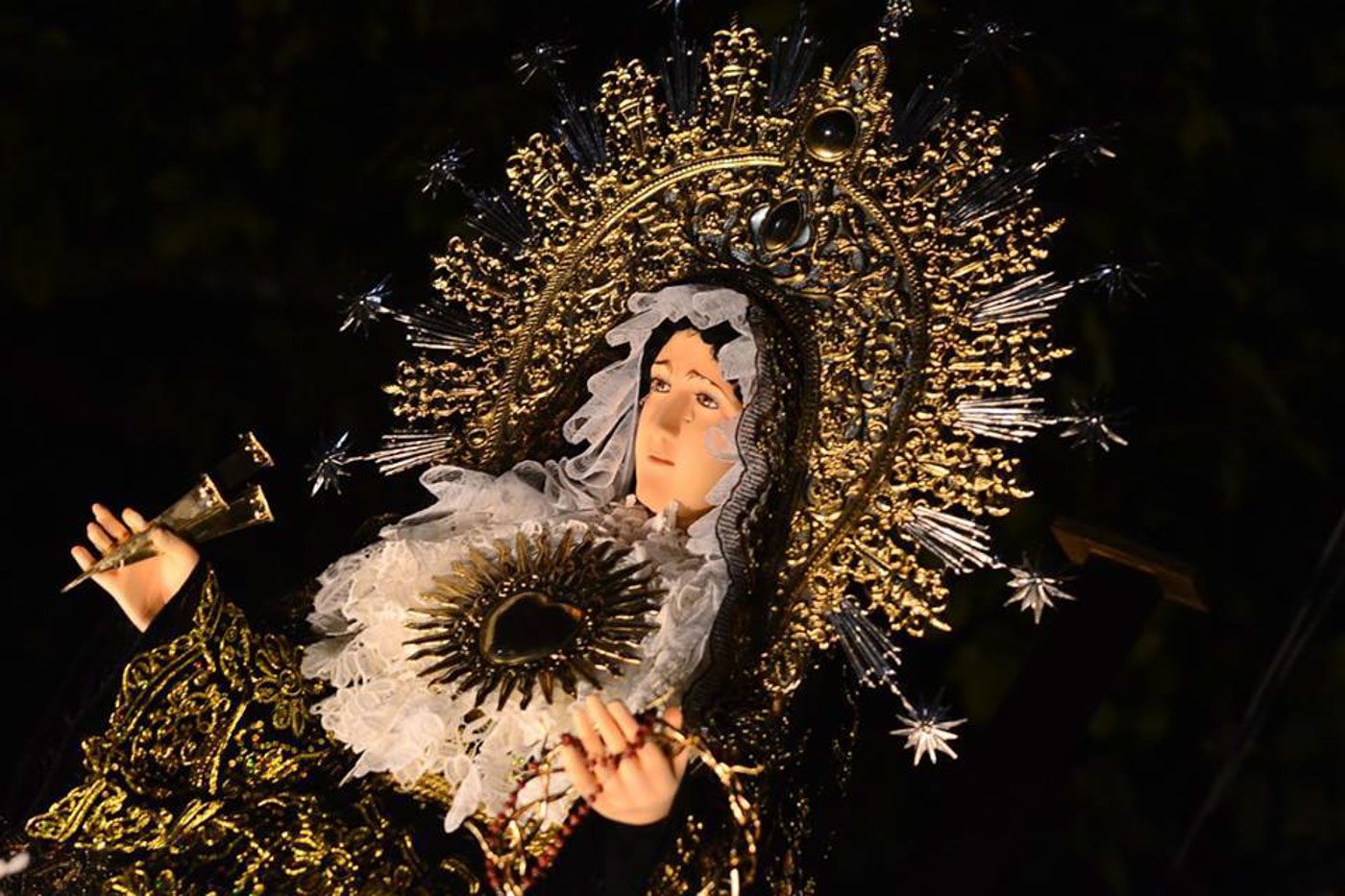 SOLEDAD/MATER DOLOROSA. She wears violet or dark blue and red on Wednesday procession and black on Friday. Photo courtesy of Mavic Conde 