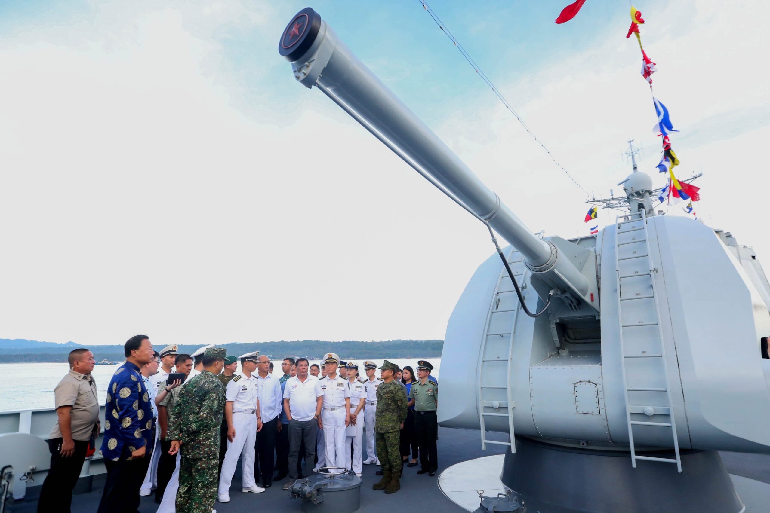 Duterte inspects China warships, jokes of missiles pointed to PH