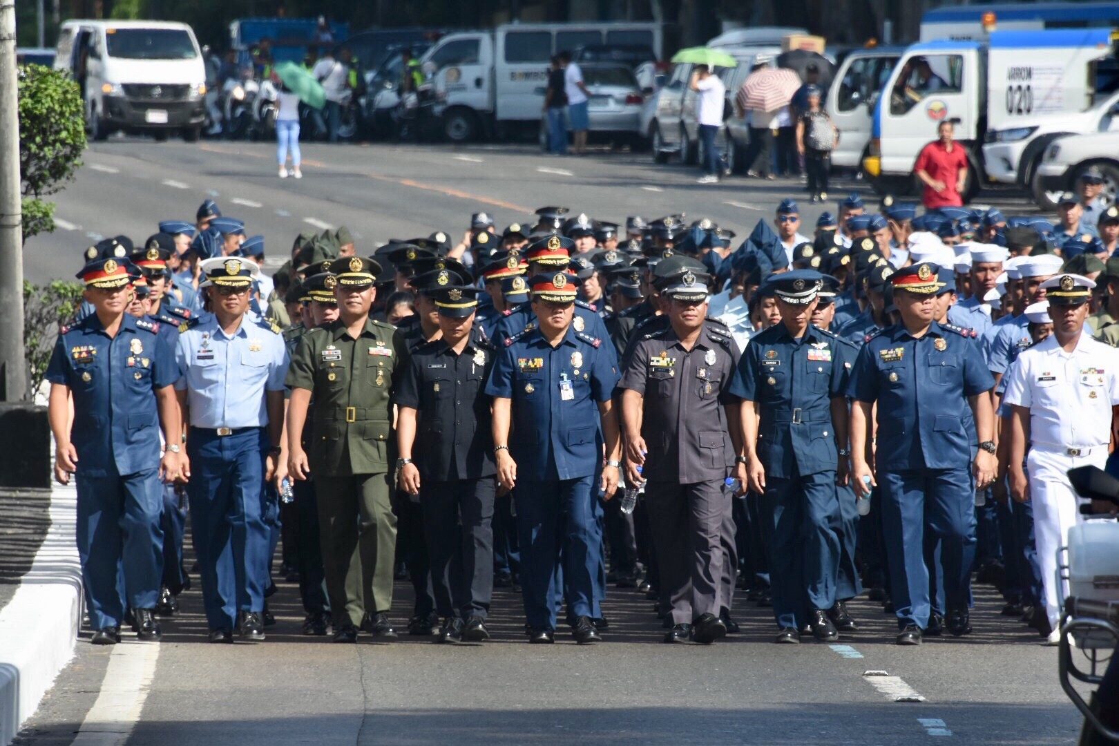 REMEMBERING EDSA. Officers from different uniformed services take part in the yearly celebration. Photo by Angie de Silva/Rappler 