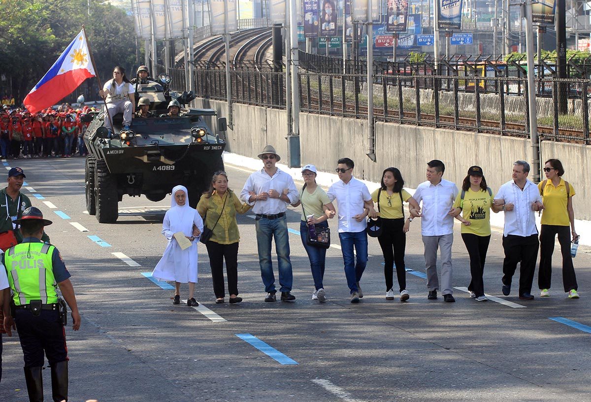 REMEMBERING EDSA. The historic 'Salubungan' between the civilian, church people and the military and police during the 32nd anniversary of the EDSA People Power Revolution at the People Power Monument in Edsa Quezon City on Sunday, February 25, 2018. The revolt toppled Ferdinand Marcos from power in 1986. Photo by DARREN LANGIT 