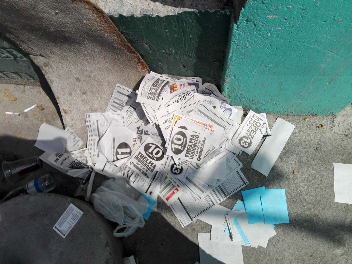 PAMPANGA. Streets along Clemente S. Dayrit Elementary School in Angeles City, Pampanga, get littered with sample ballots and flyers given by supporters at voting precincts. Photo by Allena Jaguilon   