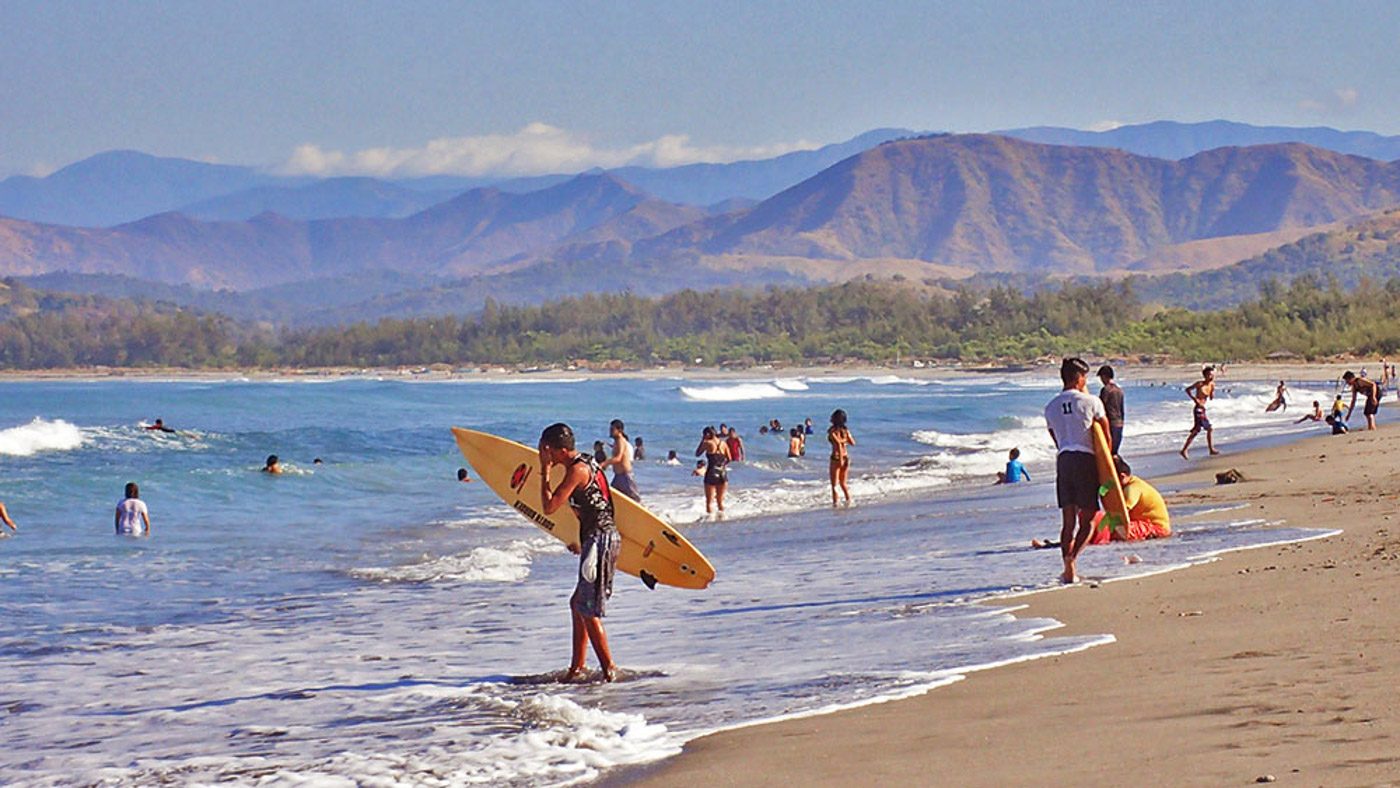 SURFING AND MORE. Liwliwa does not just offer waves for surfing but also relaxing sights of mountains, agoho trees, and more. 