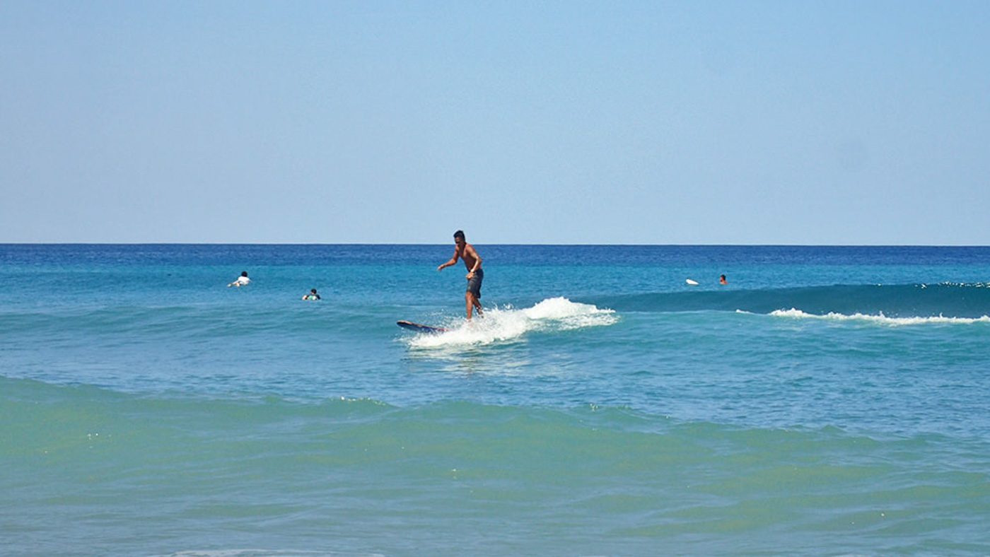 SURF’S UP! Surfing is a must-try activity in Liwliwa. 
