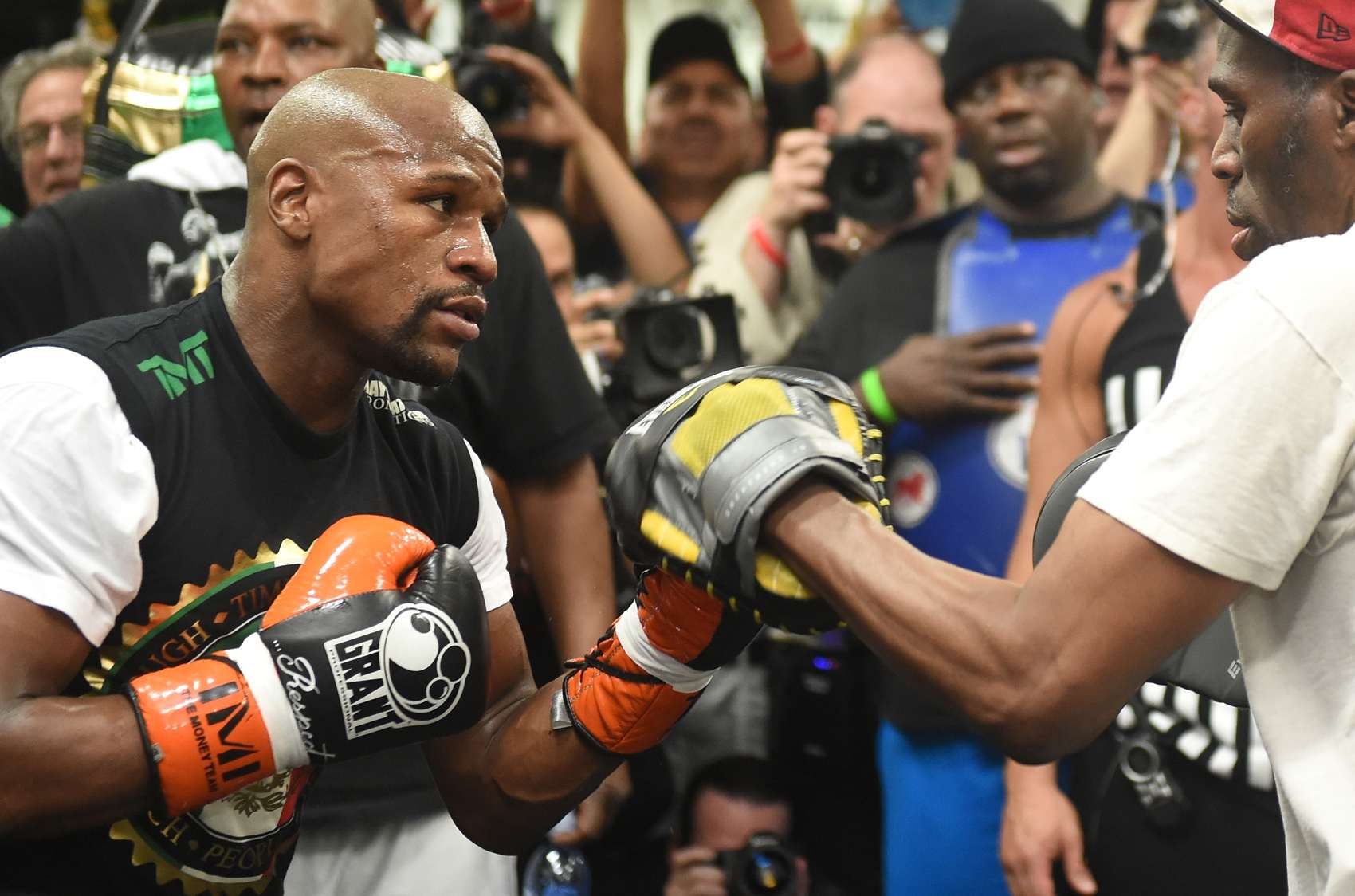 For Mayweather, changing gloves is like a NASCAR pit stop
