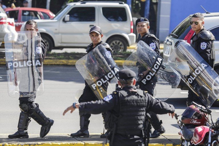 Nicaragua police arrest 20, use stun grenades to end anti-govt demo
