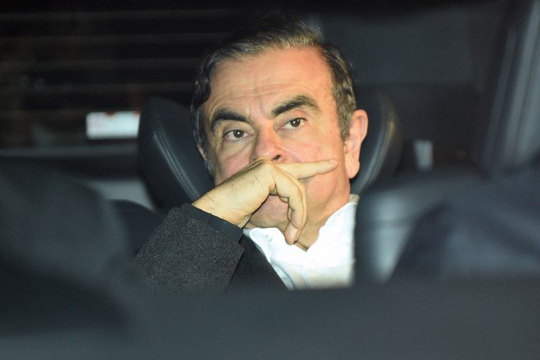'ILLEGAL.' This file photo shows former Nissan chairman Carlos Ghosn leaving his lawyers' offices in Tokyo on March 6, 2019. File photo by Kazuhiro Nogi/AFP 
