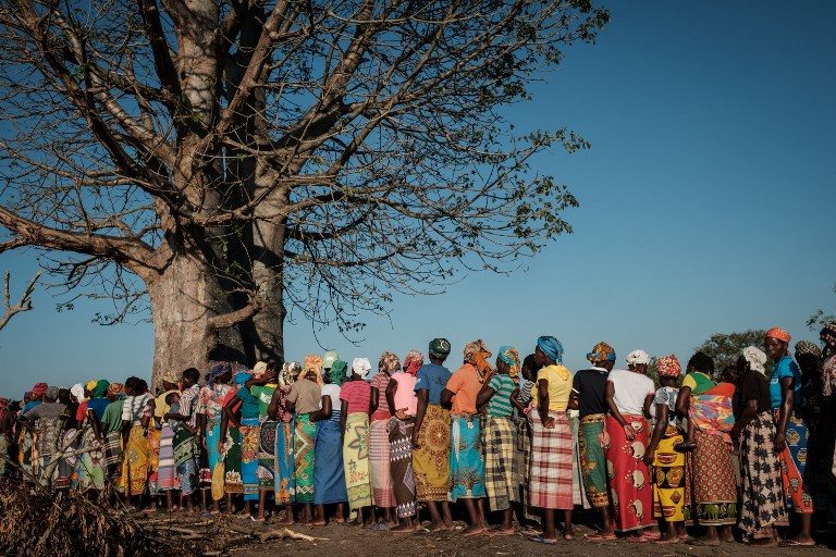LINE UP. Women wait in a line to receive relief supplies from South Africa's disaster relief organization Gift of the Givers. Photo by Yasuyoshi Chiba/AFP 