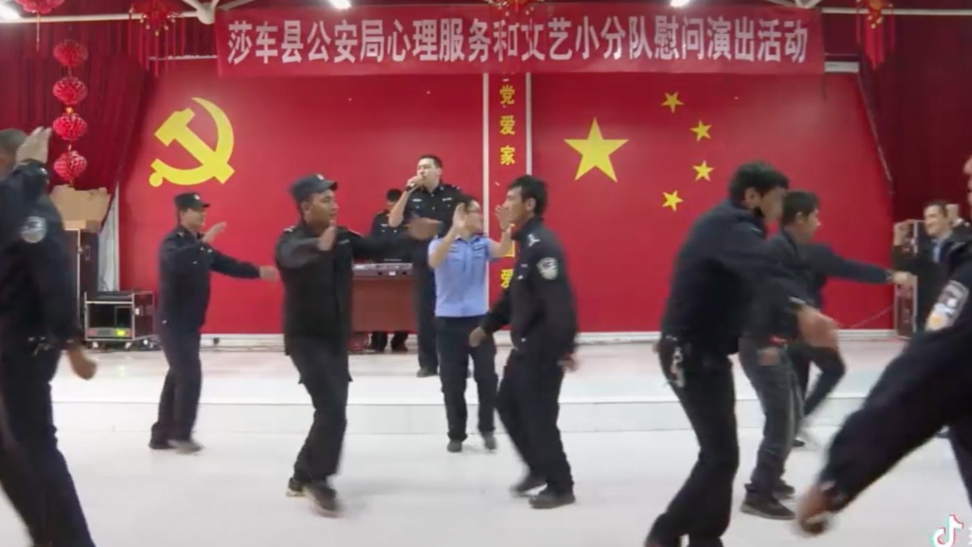 DANCE. This video on the Yarkant Police TikTok channel shows what appear to be mostly Uyghur officers dancing before the Chinese flag and the Communist symbol.
The sign above them suggests it is a psychological support session. 