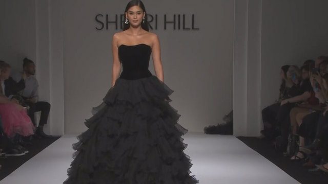 BLACK EVENING. Pia models a black gown for Sherri Hill 