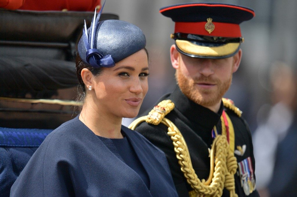 Britain’s Prince Harry and Meghan to give up royal titles