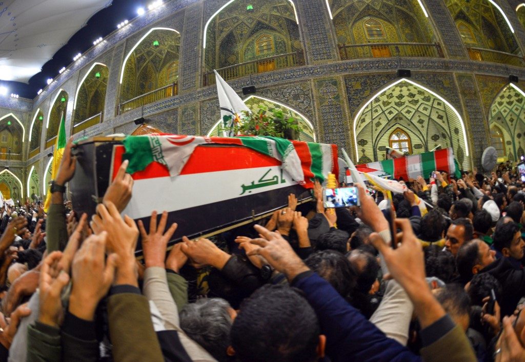 MOURNING. Mourners carry the coffins of slain Iraqi paramilitary chief Abu Mahdi al-Muhandis, Iranian military commander Qasem Soleimani and 8 others towards the Imam Ali Shrine in the shrine city of Najaf in central Iraq during a funeral procession on January 4, 2020. Photo by Haidar Hamdani/AFP 