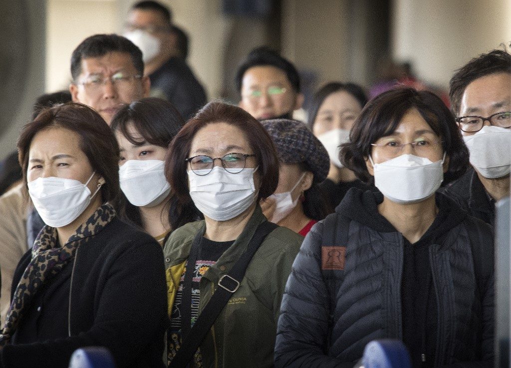 NOVEL CORONAVIRUS. Passengers wear face masks to protect against the spread of the Coronavirus as they arrive on a flight from Asia at Los Angeles International Airport, California, on January 29, 2020. Photo by Mark Ralston/AFP 