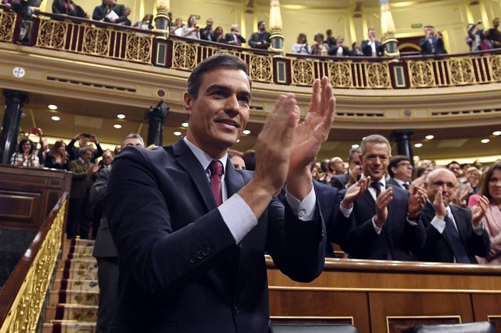 Spain’s Sanchez wins tight parliament vote to remain PM