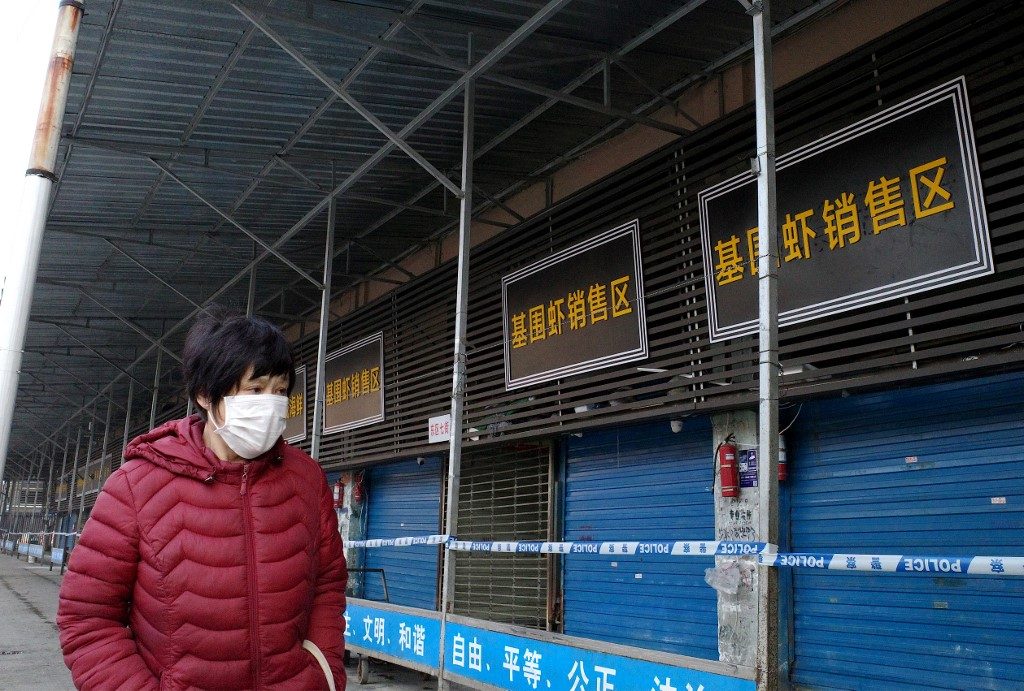 China locks down cities to curb virus outbreak