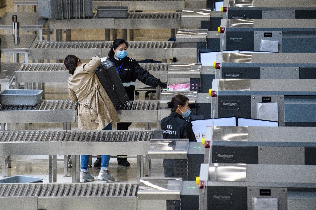 Hong Kong slashes border crossings with China over virus