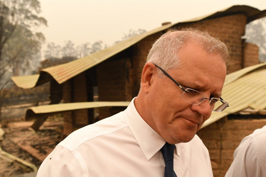 EMBATTLED PM. Australia's Prime Minister Scott Morrison visits a wildflower farm in an area devastated by bushfires in Sarsfield, Victoria state on January 3, 2020. Photo by James Ross/Pool/AFP 