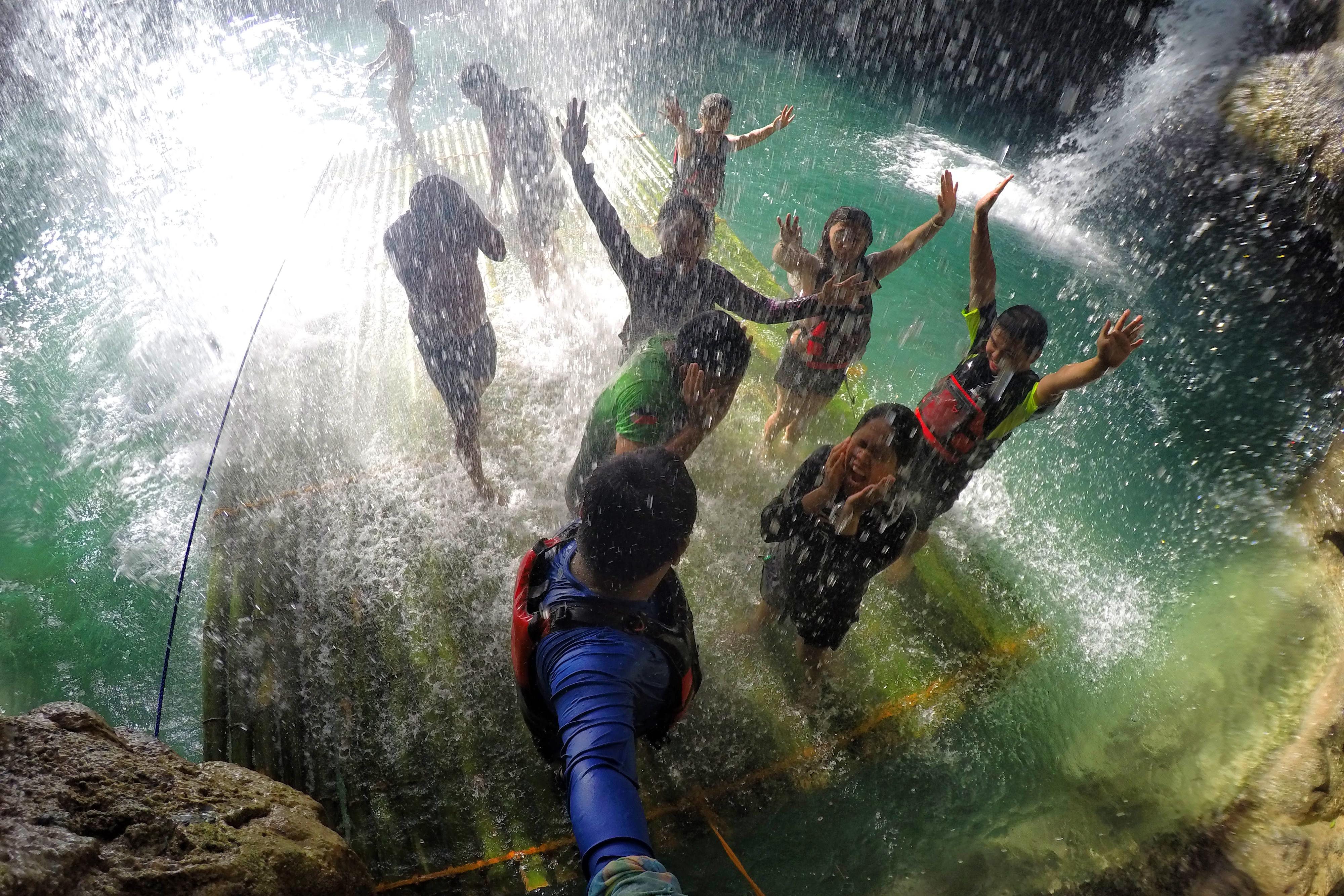 NATURE'S MASSAGE. At the second level of Kawasan, this giant shower can soothe body pains as its cascading water seems like a massage. Photo by Louie Lapat/Rappler  