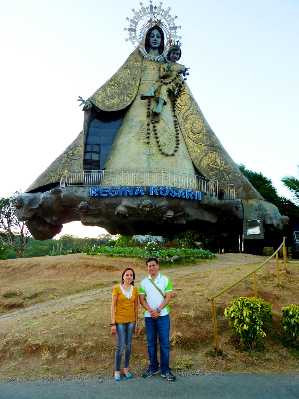 RECOLLECTION. Highlighting the recent Lenten pilgrimage of Green Faith Travels in Rizal is the recollection for pilgrims at Regina Rosarii Institute of Contemplation in Asia (Regina RICA) in Tanay. GFT facilitators Judit Mangahis and Edwin Galvez stand before the 71-foot image of Mother Mary, one of the features of Regina RICA. Photo from Green Faith Travels 