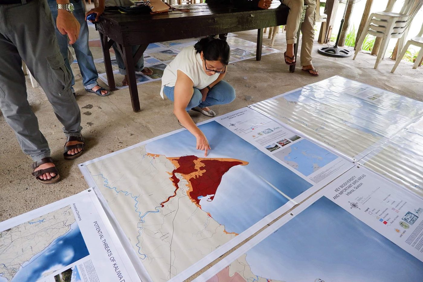 FLOOD SUSCEPTIBILITY. A participant in the National Land Observatory Workshop looks at the flood-prone area in Infanta, Quezon. Photo by PAKISAMA 