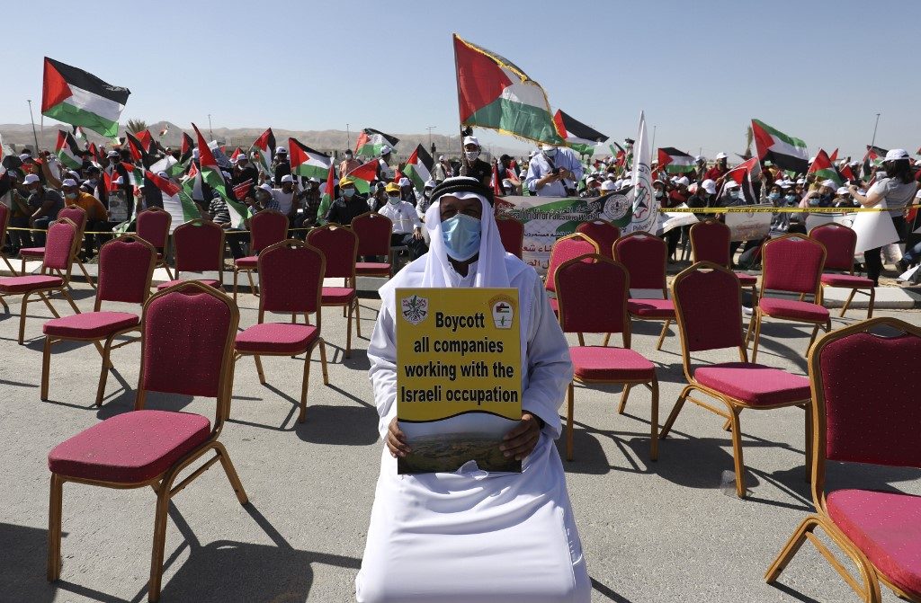SIGN. Palestinians participate in a big rally to protest against Israel's plan to annex parts of the occupied West Bank, in Jericho on June 22, 2020. Photo by Abbas Momani/AFP 